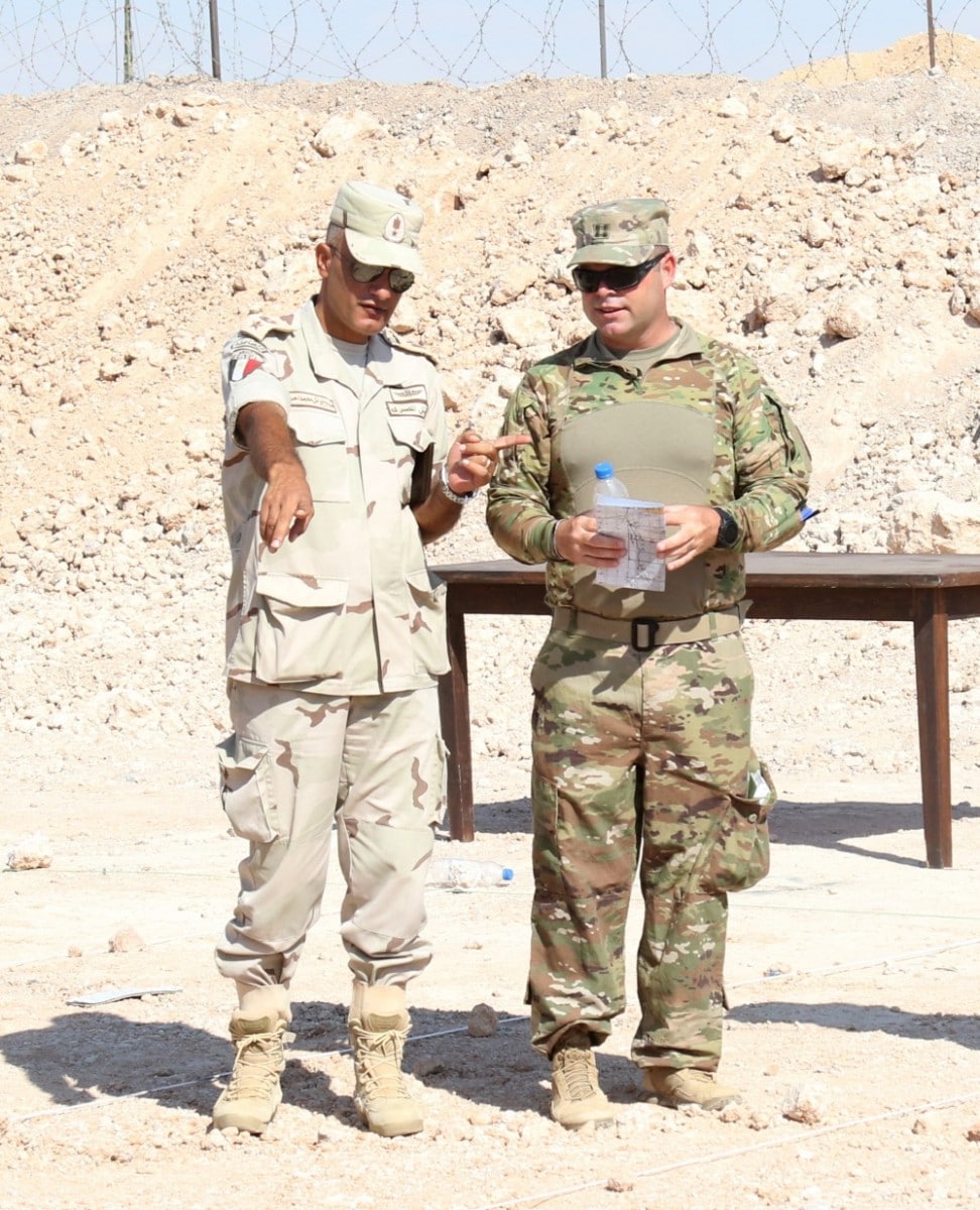 MOHAMED NAGUIB MILITARY BASE, Egypt – Capt. John Rowland (RIGHT), commander for Alpha Company, 1st Battalion, 155th Infantry Regiment, 155th Armored Brigade Combat Team, Task Force Spartan, discusses the movement of the joint forces during the operation order brief before the situational training exercise, on September 13, 2018. The Bright Star 18 STX lane challenged a joint force of Jordanian, Egyptian, and U.S. armed forces to challenge different events like an improvised explosive device, opposing forces, and more.(U.S. Army photo by Staff Sgt. Matthew Keeler)