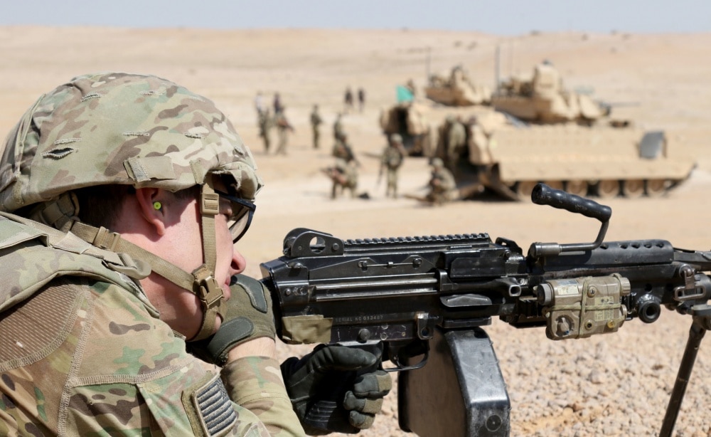 MOHAMED NAGUIB MILITARY BASE, Egypt – Spc. Zachary Johnson, M249 gunner for Alpha Company, 1st Battalion, 155th Infantry Regiment, 155th Armored Brigade Combat Team, Task Force Spartan, provides cover for Soldiers dismounting from their Bradley Fighting Vehicles during the Situational Training Exercise on September 13, 2018. The event was part of Bright Star 18 and combined the U.S., Egyptian, and Jordanians armed forces. (U.S. Army photo by Staff Sgt. Matthew Keeler)