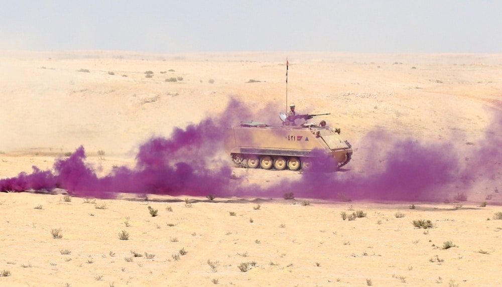 MOHAMED NAGUIB MILITARY BASE, Egypt – An Egyptian Armored Personnel Carrier moves through smoke to reach their objective during the Situational Training Exercise on September 13, 2018. The Bright Star 18 STX lane combined the U.S., Egyptian, and Jordanian armed forces. (U.S. Army photo by Staff Sgt. Matthew Keeler)