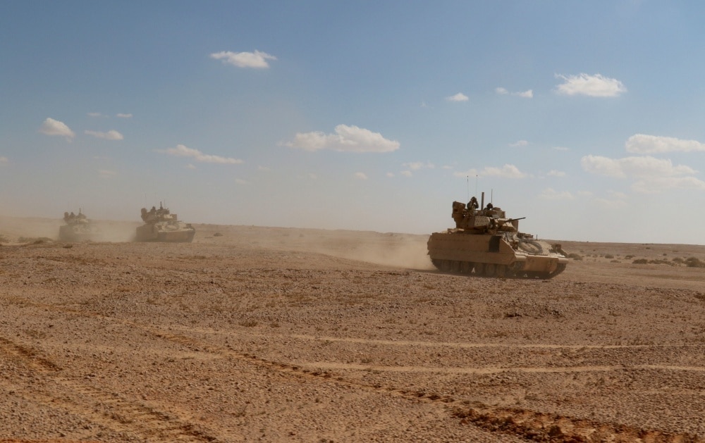 MOHAMED NAGUIB MILITARY BASE, Egypt – Bradley Fighting Vehicles from Alpha Company, 1st Battalion, 155th Infantry Regiment, 155th Armored Brigade Combat Team, Task Force Spartan, move back to base after completing the Situational Training Exercise lane on September 13, 2018. The Bright Star 18 STX lane combined Bradleys, Abrams Main Battle tanks, and allied armed forces from Egypt and Jordan, to accomplish the mission. (U.S. Army photo by Staff Sgt. Matthew Keeler)